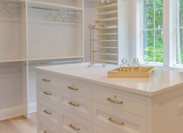 Custom closet with inlay drawer fronts and adjustable shoe shelves