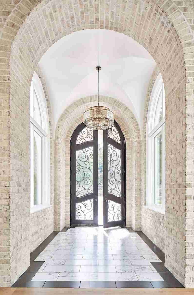 Custom iron door arched with decorative inlay